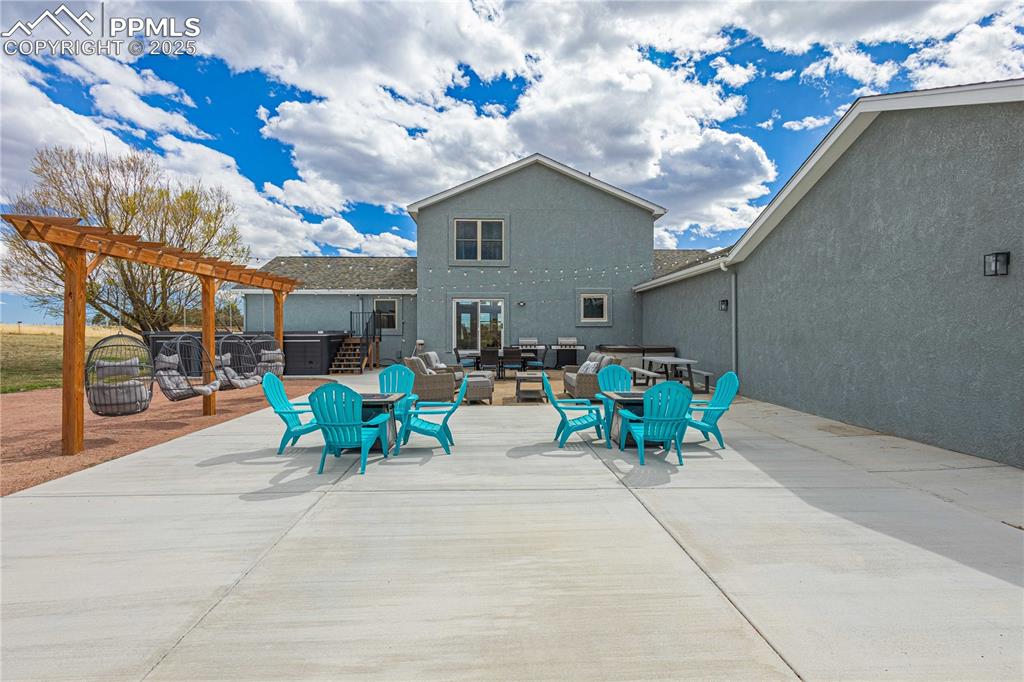 View from the stamped concrete front patio with mountain view and Pikes Peak views