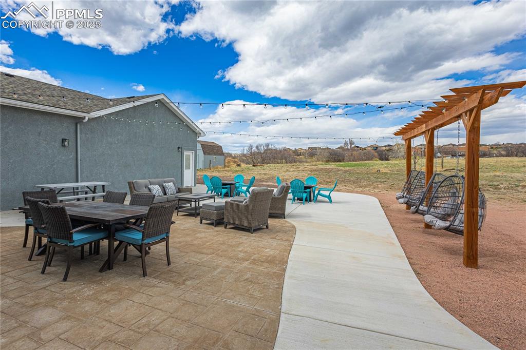 Stamped concrete patio with spacious sidewalk