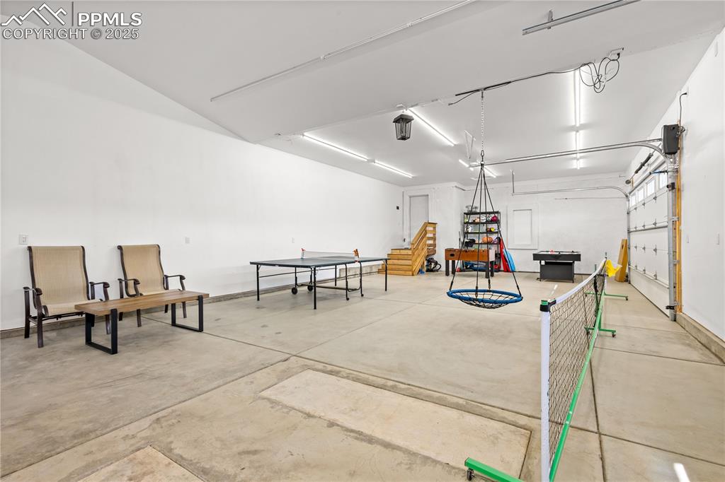 Spacious four car garage has room for vehicles and other storage needs. 