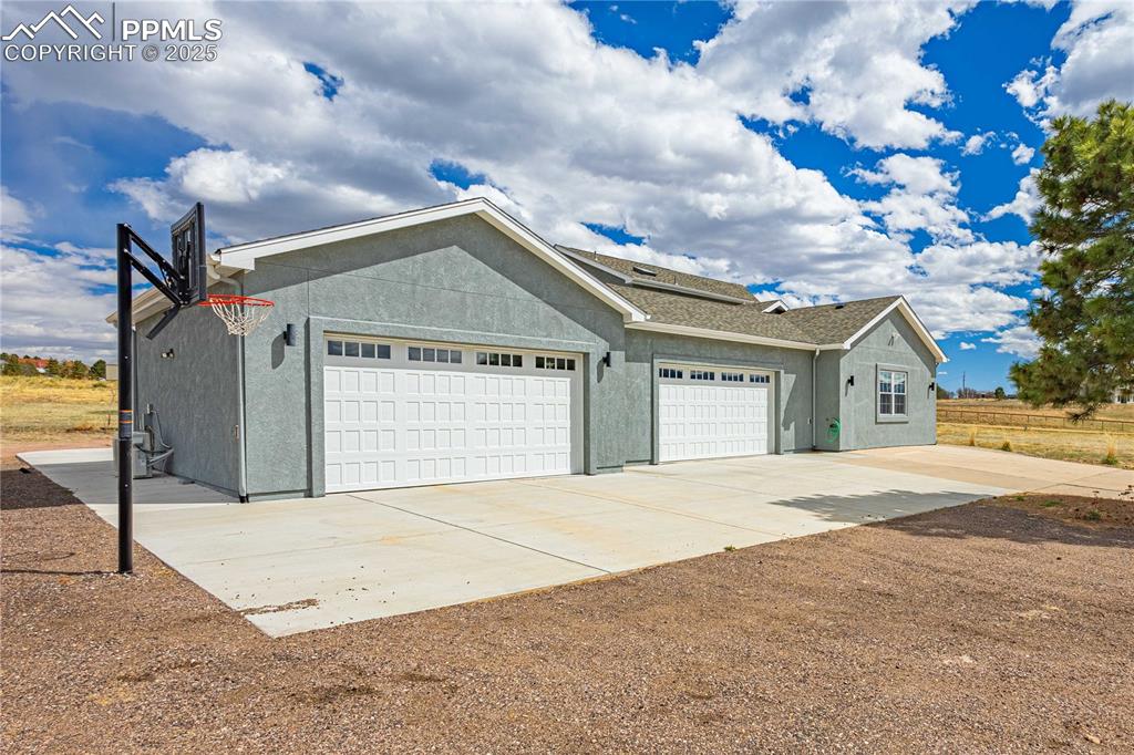 Four car garage and room to play basketball.