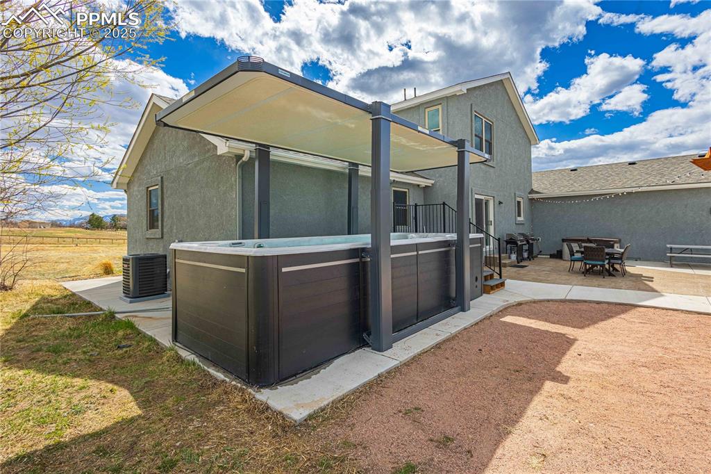 Large swim pool with cover for protection from the sun. 