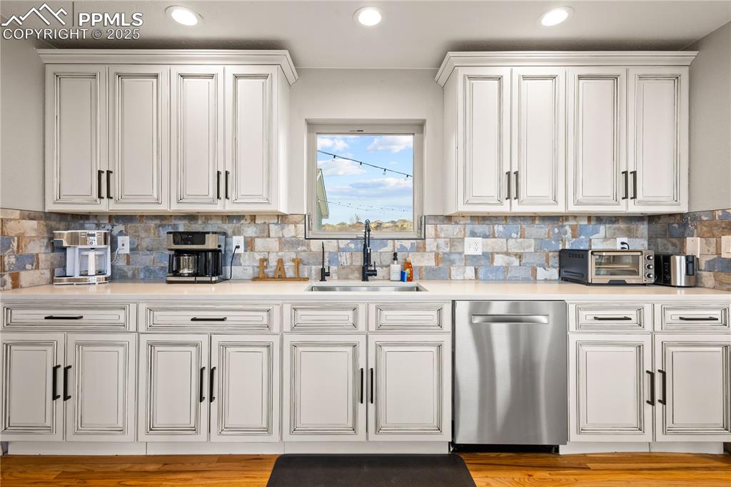 Beautifully remodeled kitchen with window overlooking the backyard.