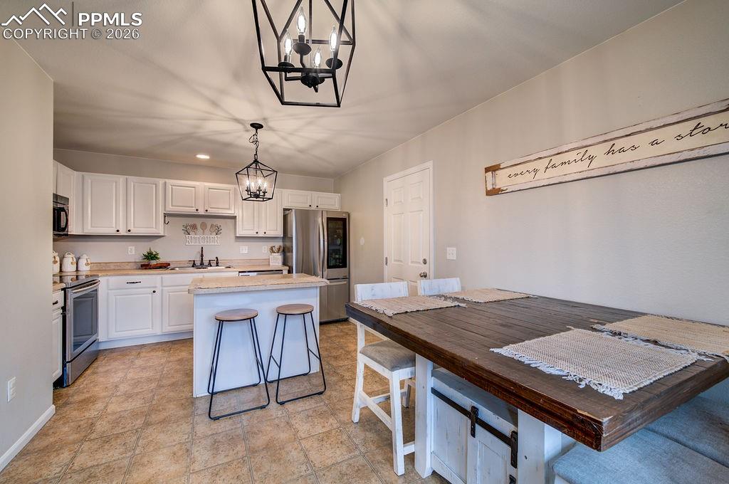The Dining Area is located off the Kitchen making it easy for food service and clean up.