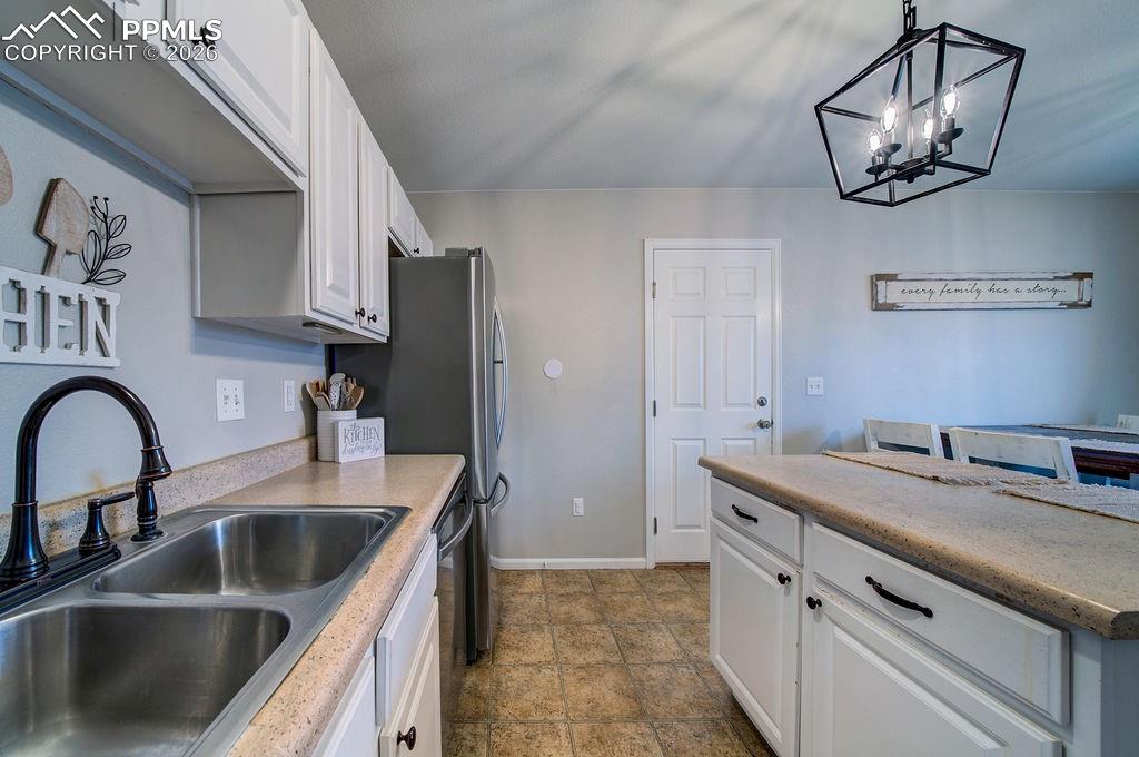 The Kitchen features a dual stainless steel sink.