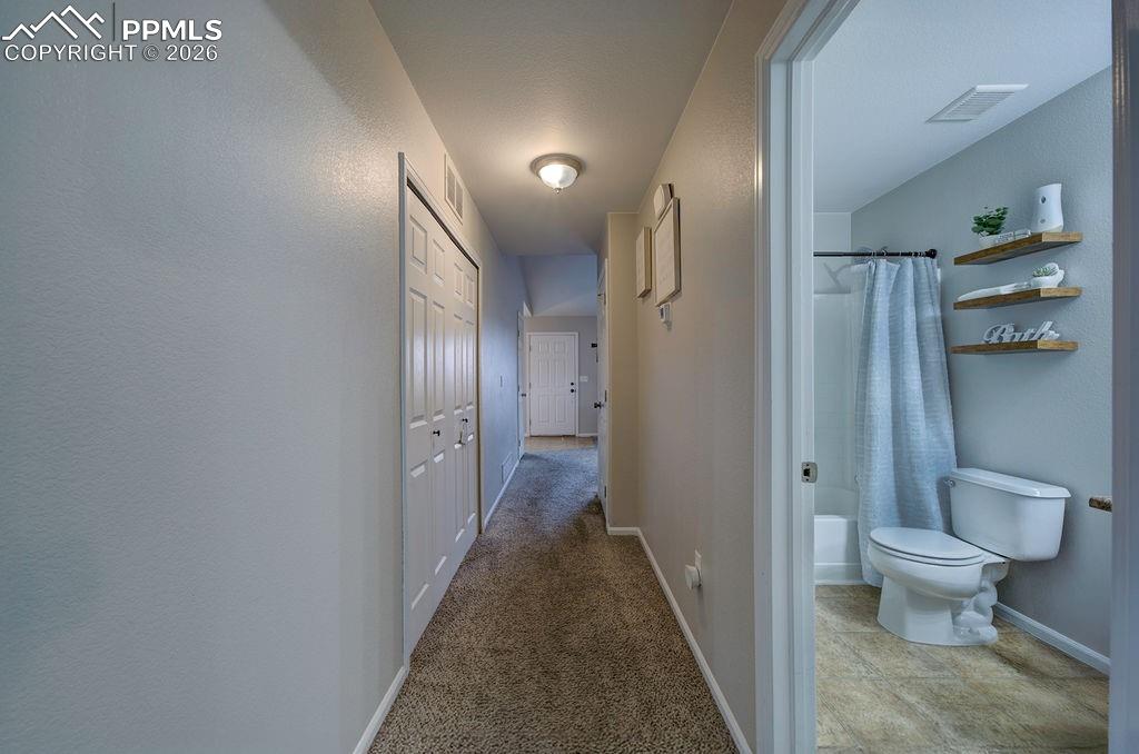 View into the Hall Bathroom and Laundry Closet.
