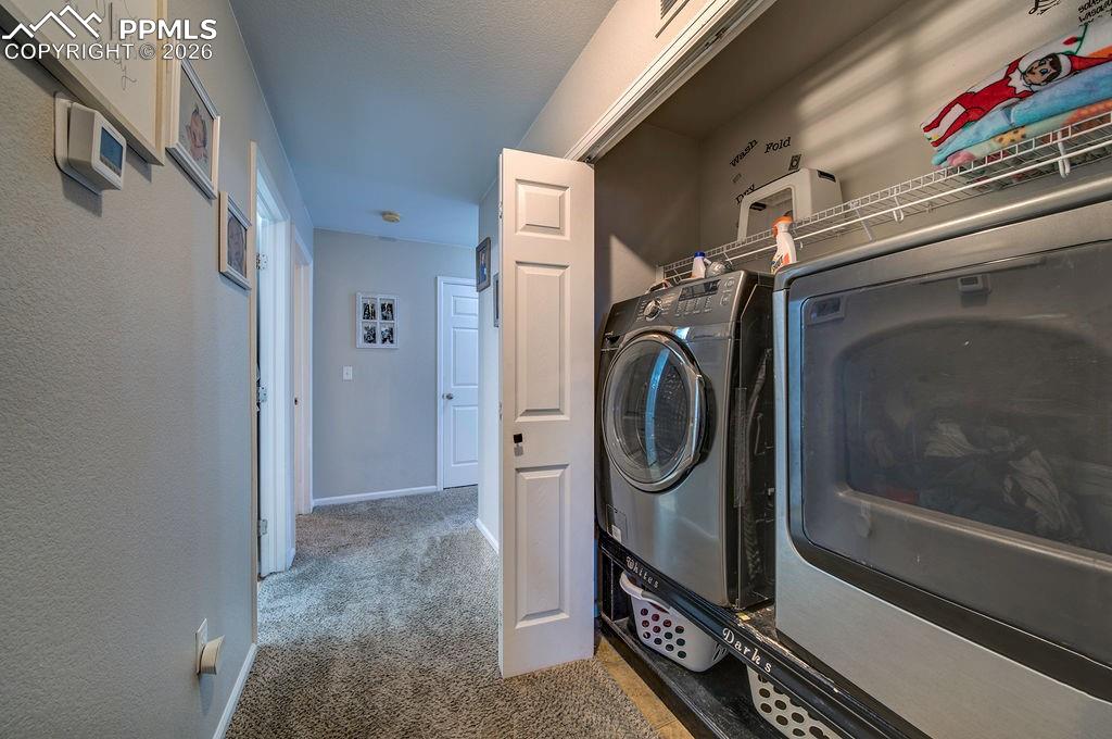 Laundry closet with washer and dryer that stay.