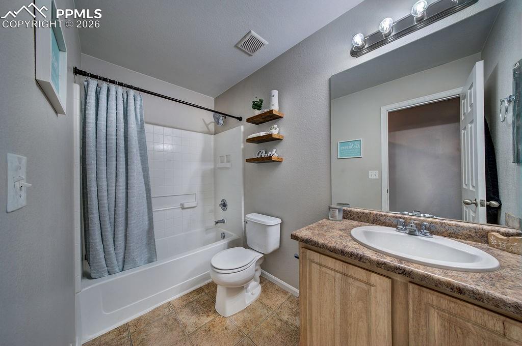 Full Hall Bathroom with vanity, mirror, and 