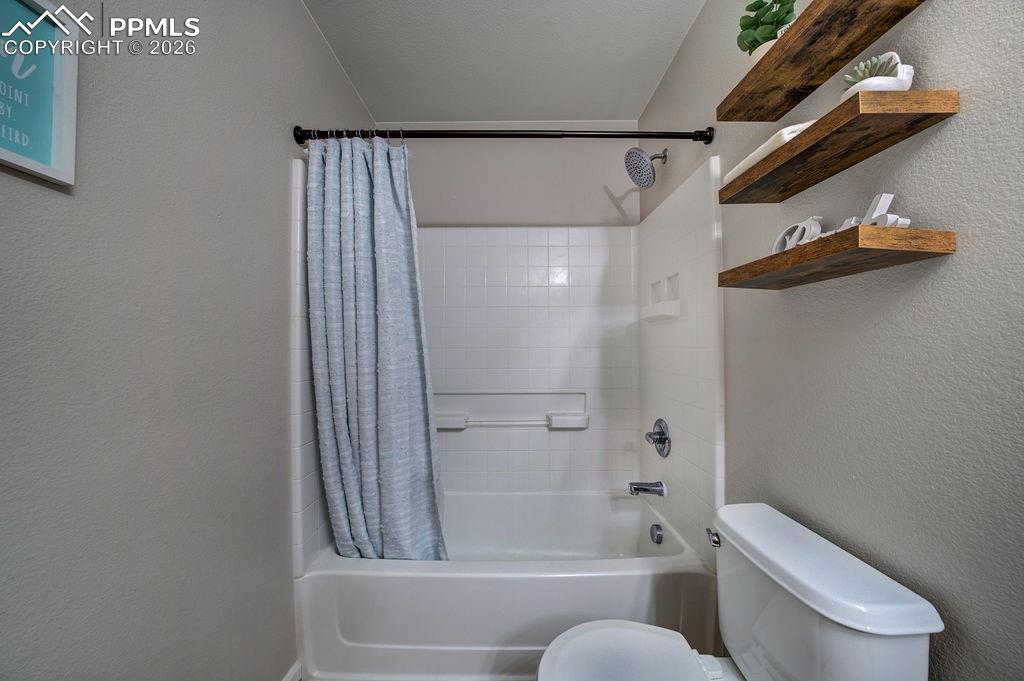 Tiled tub/shower in Full Hall Bathroom.