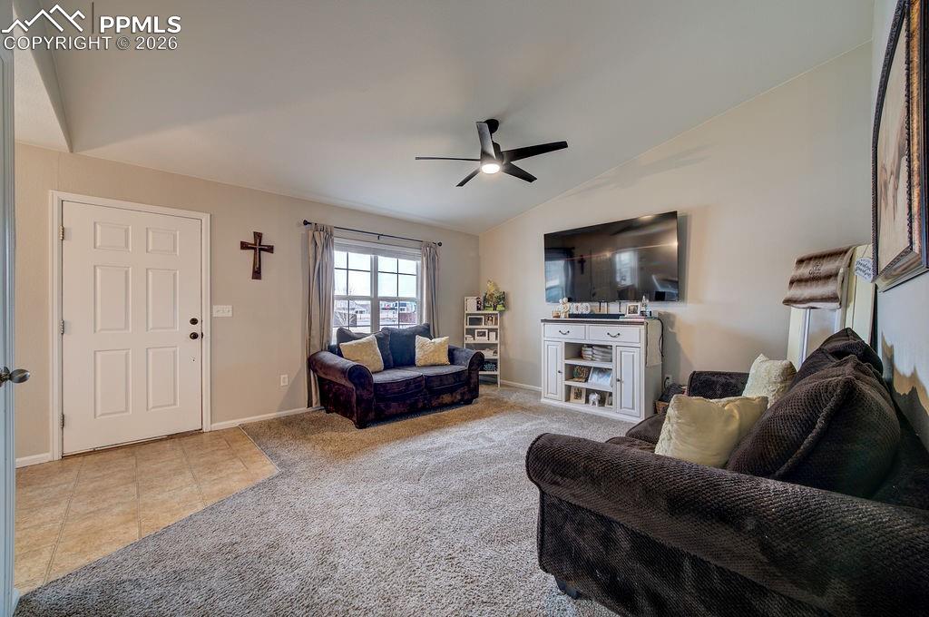 Vinyl front entry into the Living Room with large view window to the front yard.