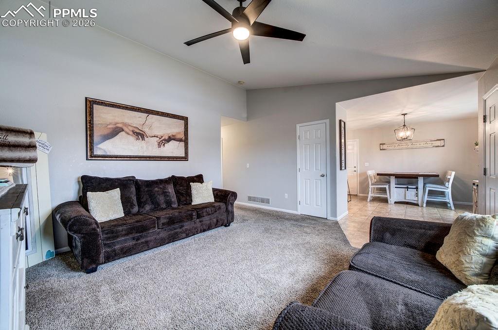 Living Room into the Dining Area and Kitchen.