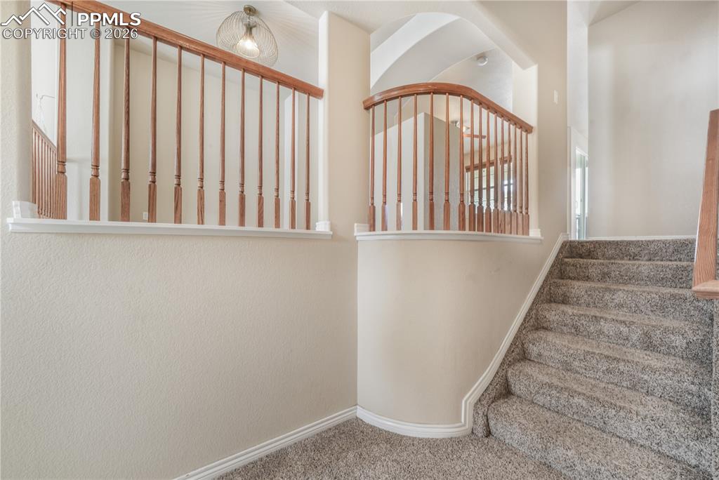 Stairs to dining area, kitchen, family room