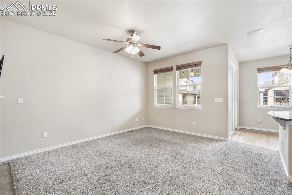Family room with gas fireplace, access to kitchen and walk out deck
