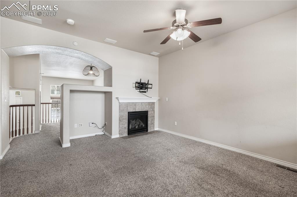 Family room with gas fireplace, access to kitchen and walk out deck