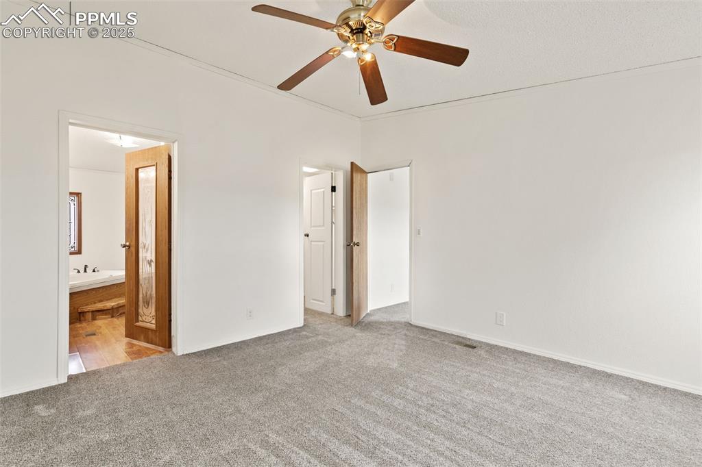 Primary bedroom with attached bath and walk in closet