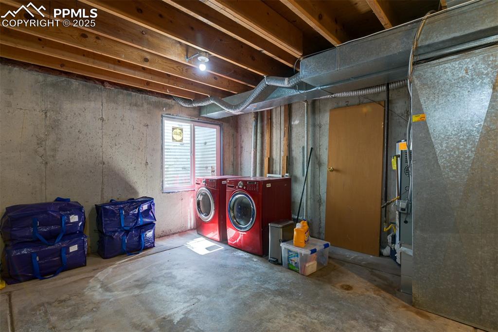 Laundry area and unfinished basement. Perfect for storage or finish and add additional living space.