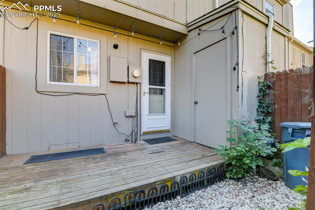 Private fenced patio off the kitchen area. Additional storage area as well. 