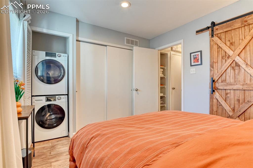 Stacked Laundry Units tucked away in Primary Bedroom