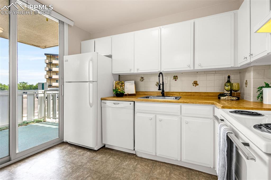 Light and bright kitchen also opens to private patio
