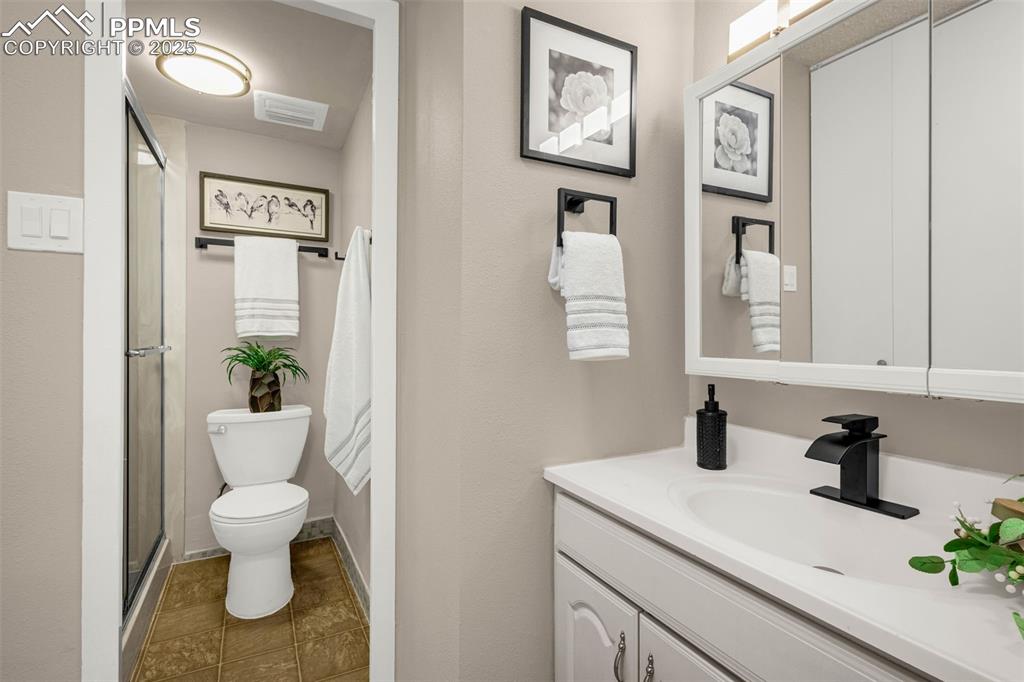 Primary Bathroom has separate vanity and free-standing shower plus HUGE closets!