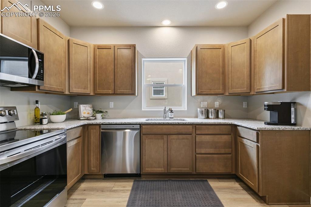 Kitchen with appliances with stainless steel finishes, granite countertops

This photo is from the same floor plan. Colors may vary slightly....