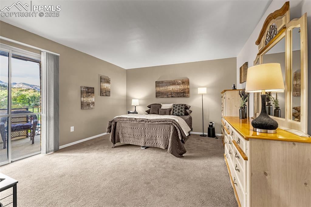 Primary bedroom with walk-out to private balcony