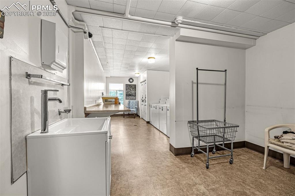 Large, clean common laundry room on main floor