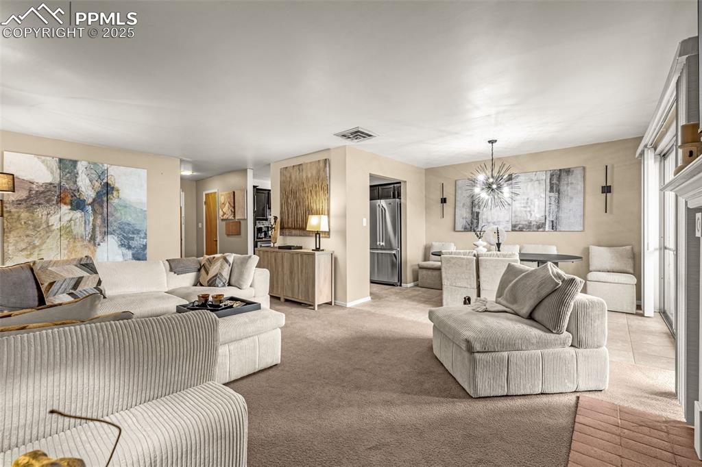 View from the fireplace towards the kitchen and main entry door