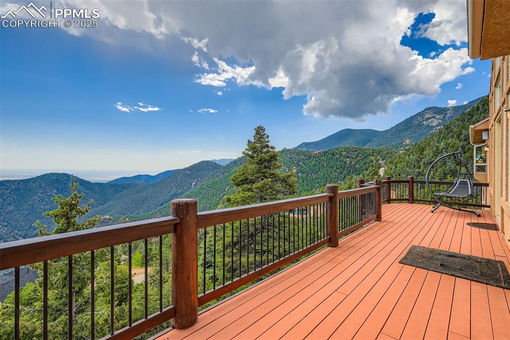 Expansive deck featuring a mountain view to the Plains and Colorado Springs