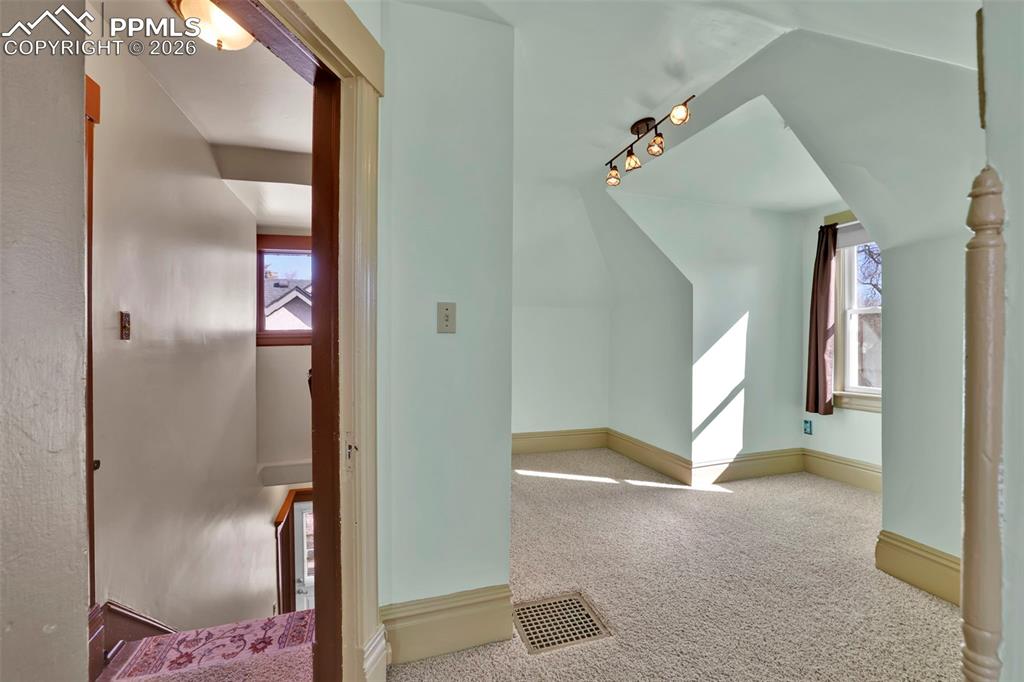 stairs and secondary upstairs bedroom