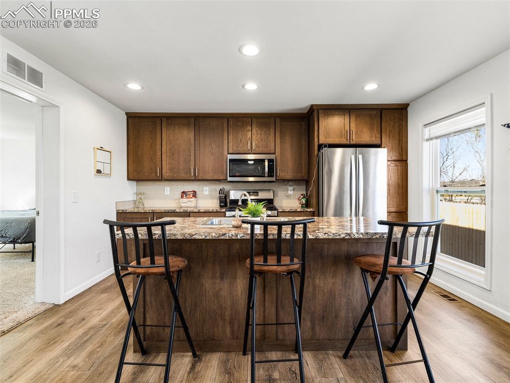 Beautiful kitichen with stainless appliances and a pantry