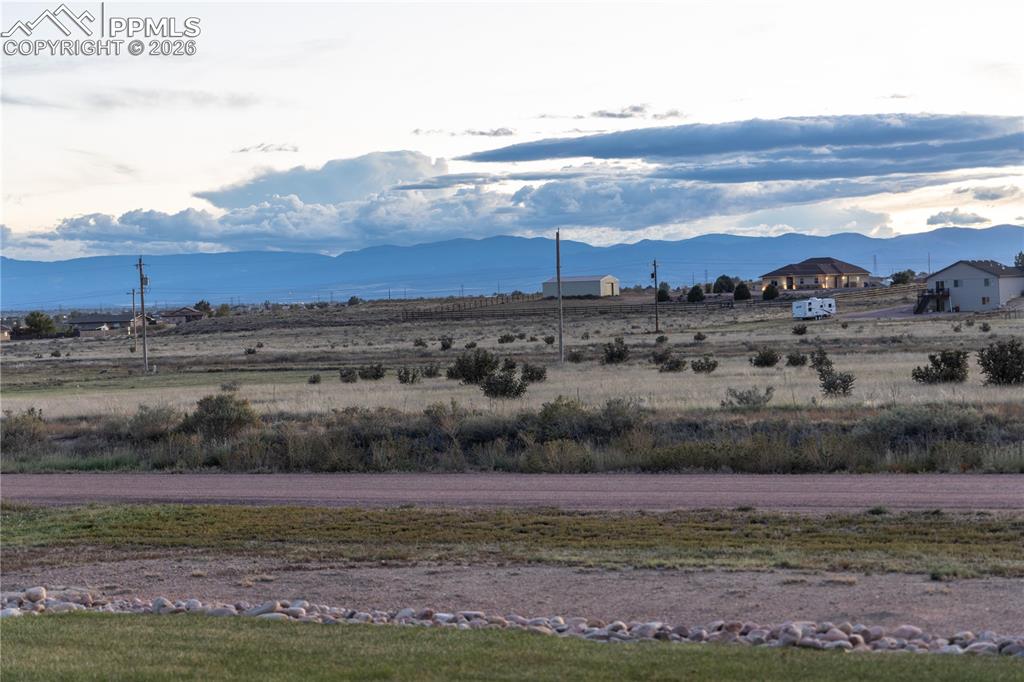 View of mountain background featuring rural landscape