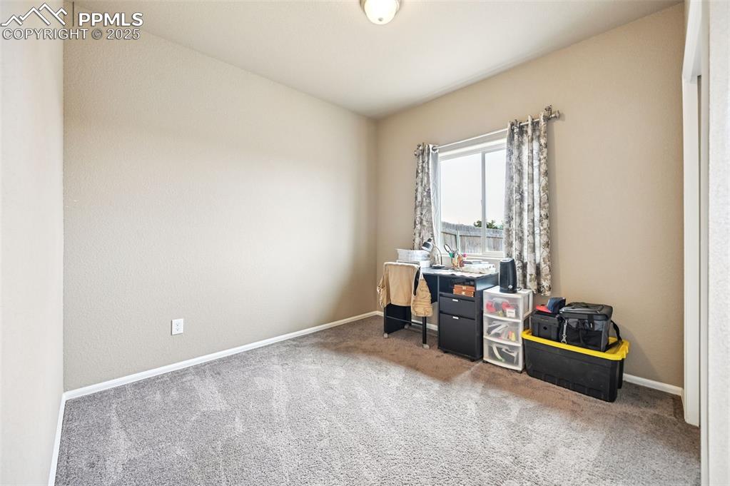 Office area with carpet and baseboards