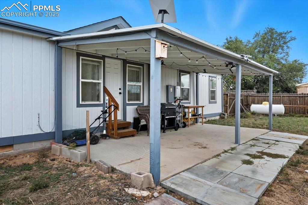 Rear view of house with a patio area