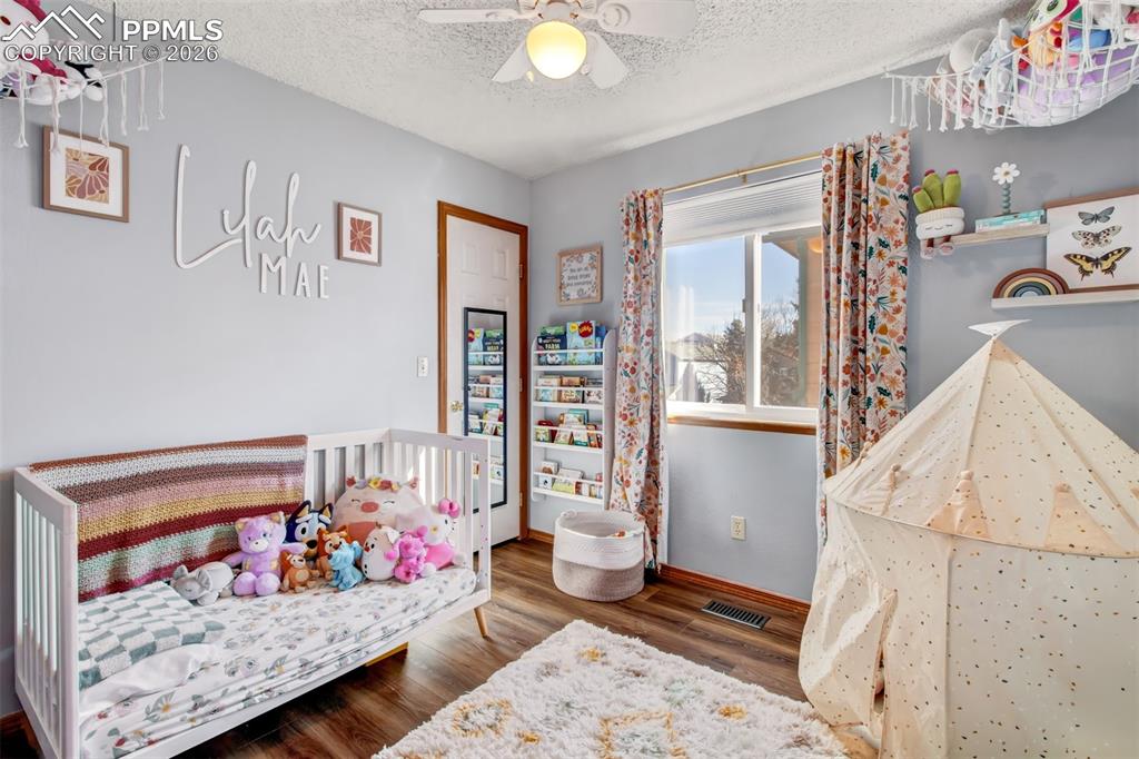 Second upper level bedroom great for family, guests or a home office space