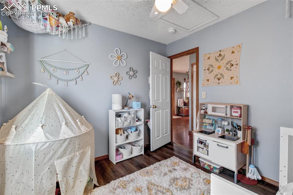 The second upper level bedroom also offers attic access