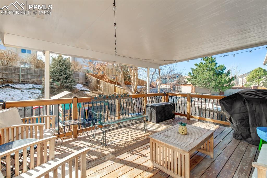 Head out from the upper living space to the large covered wood deck