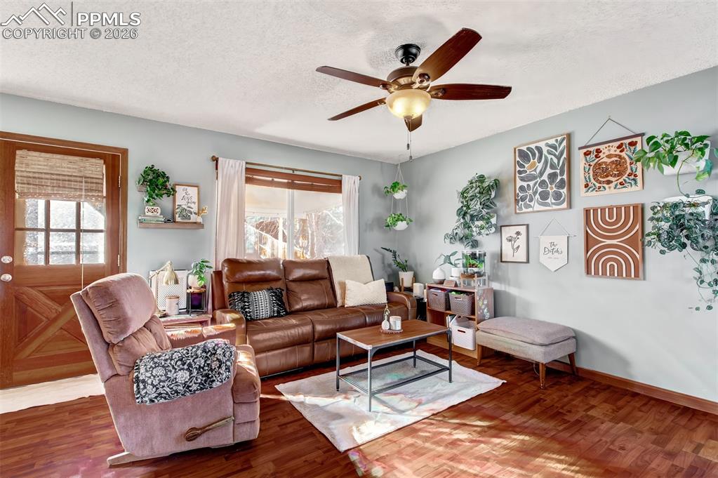 The living room has walkout access to the large covered wood deck