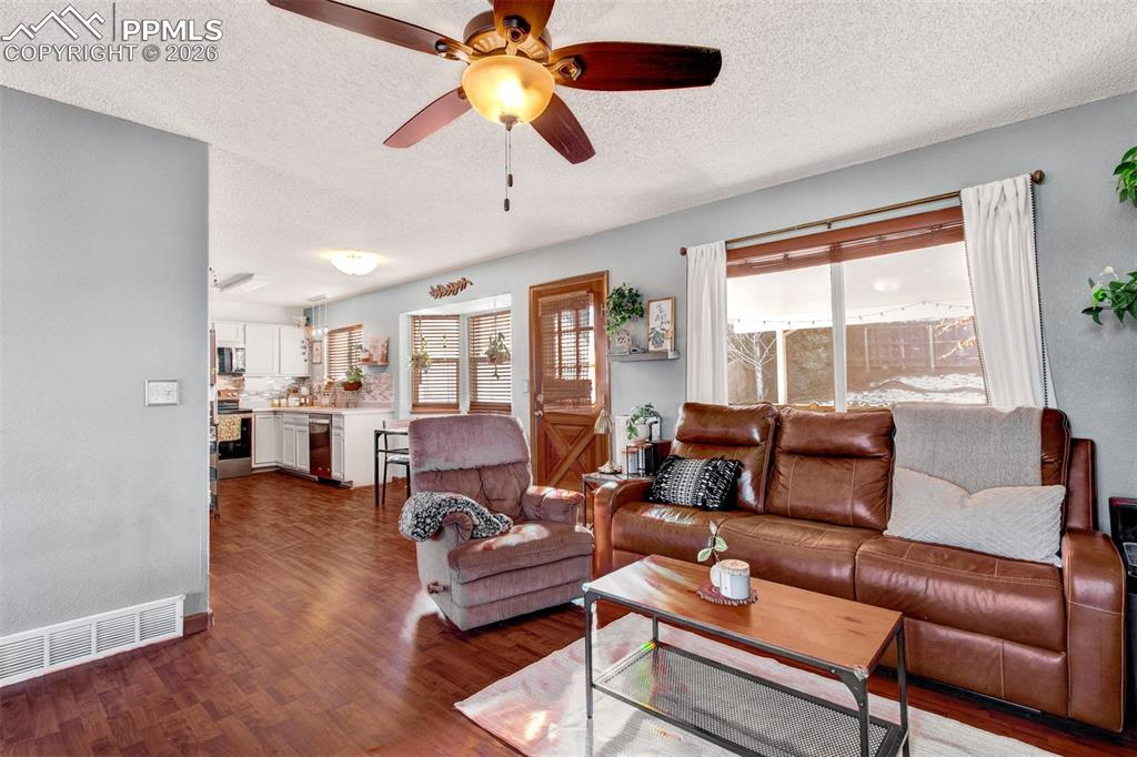 The living room connects to the dining and kitchen spaces giving you an open layout