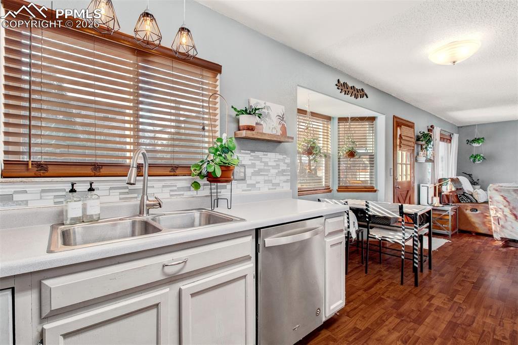 Double stainless steel sink with disposal and built-in faucet sprayer