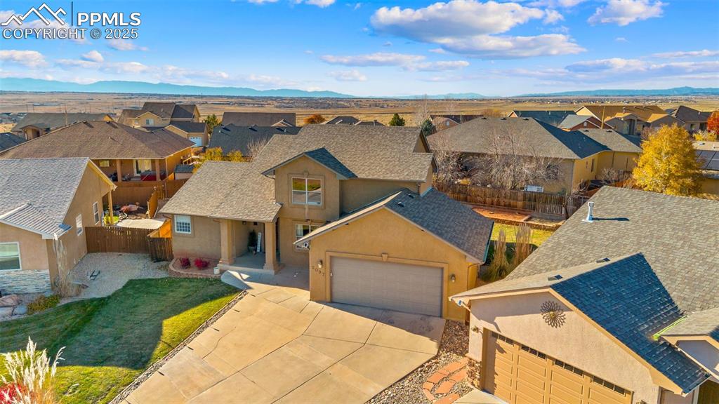 Aerial view of residential area featuring mountains