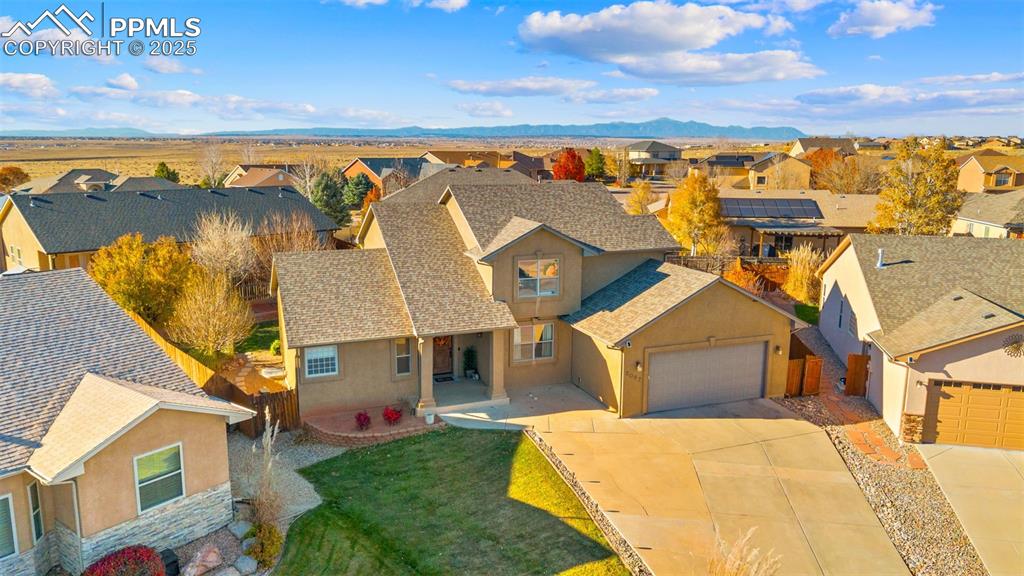 Aerial view of residential area with a mountainous background