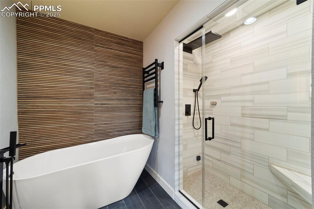Primary Full bath just renovated and featuring a spacious walk-in closet, a freestanding tub, steam shower/spa shower, double vanity, recessed lighting.