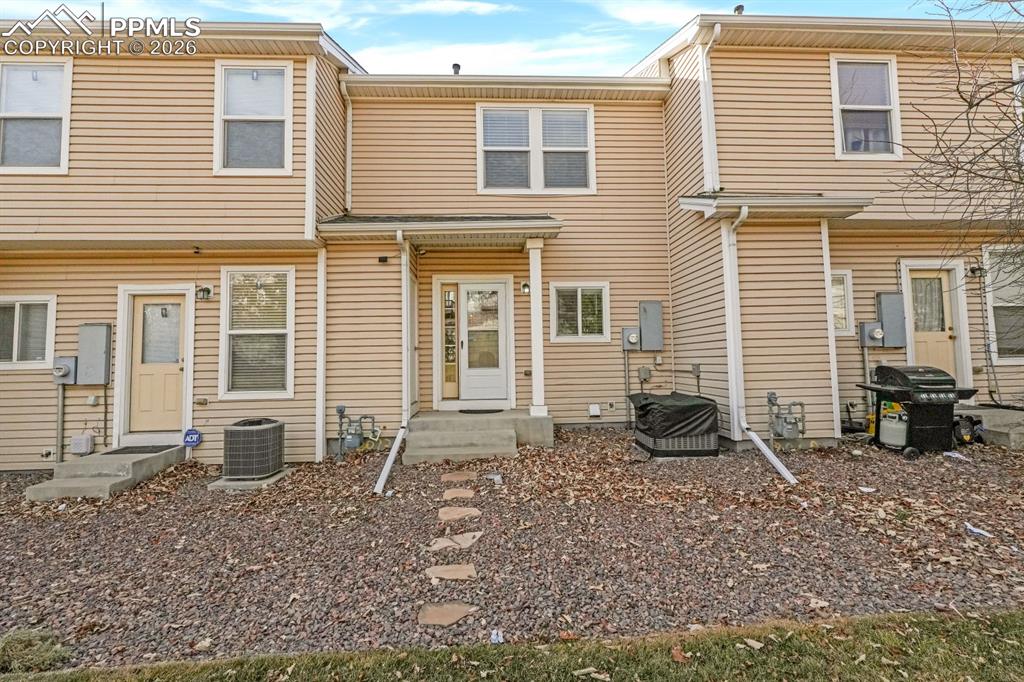 Rear view of house with entry steps