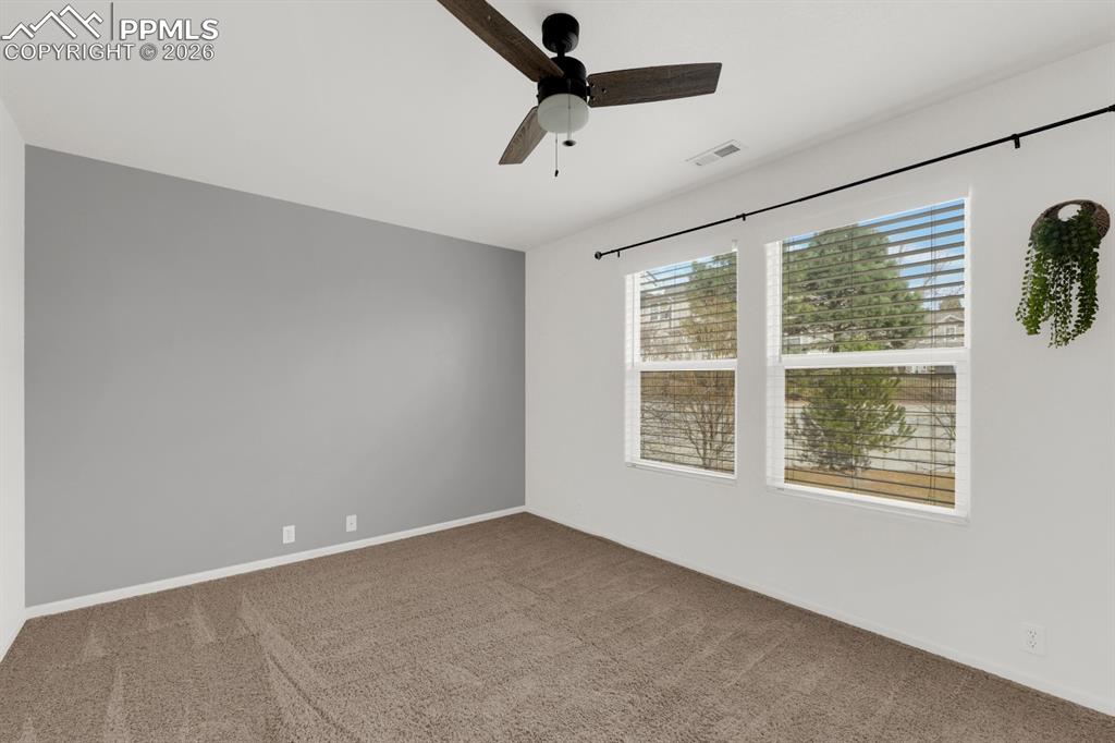 Bedroom featuring carpet flooring and ceiling fan