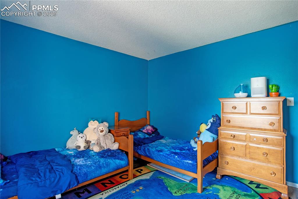 Bedroom with a textured ceiling