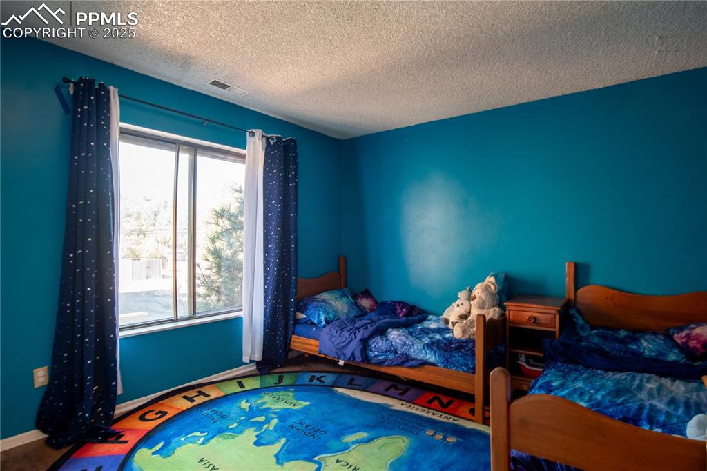 Bedroom with large windows and mountain views 