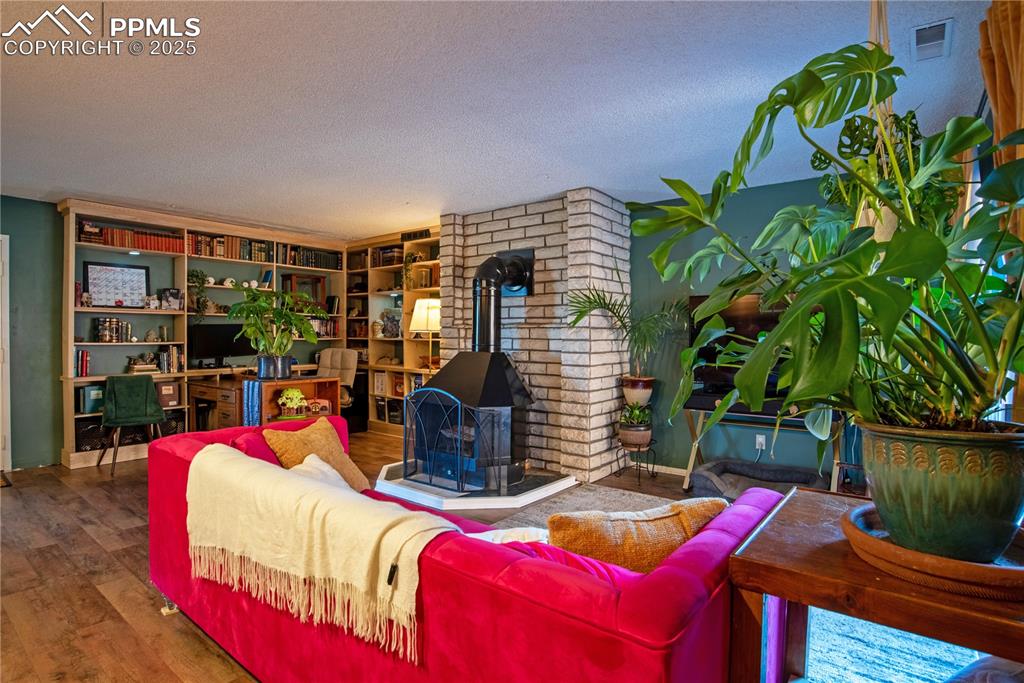 Living room featuring a wood-burning fireplace 