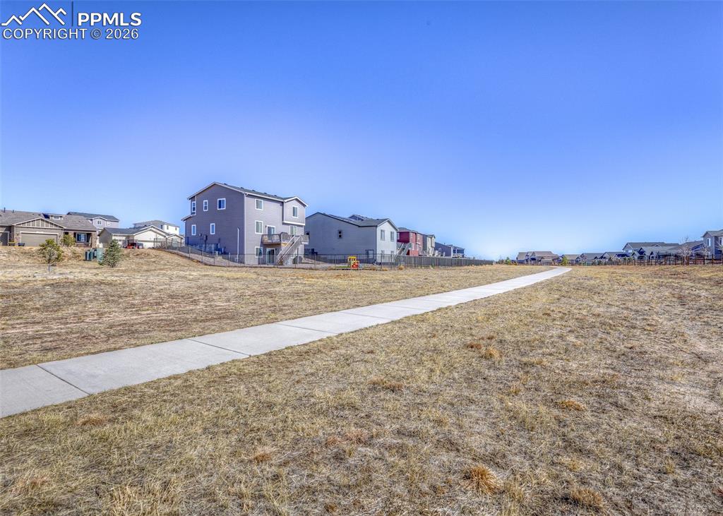 walking trail and open space directly behind the home with no neighbors to the west. 
