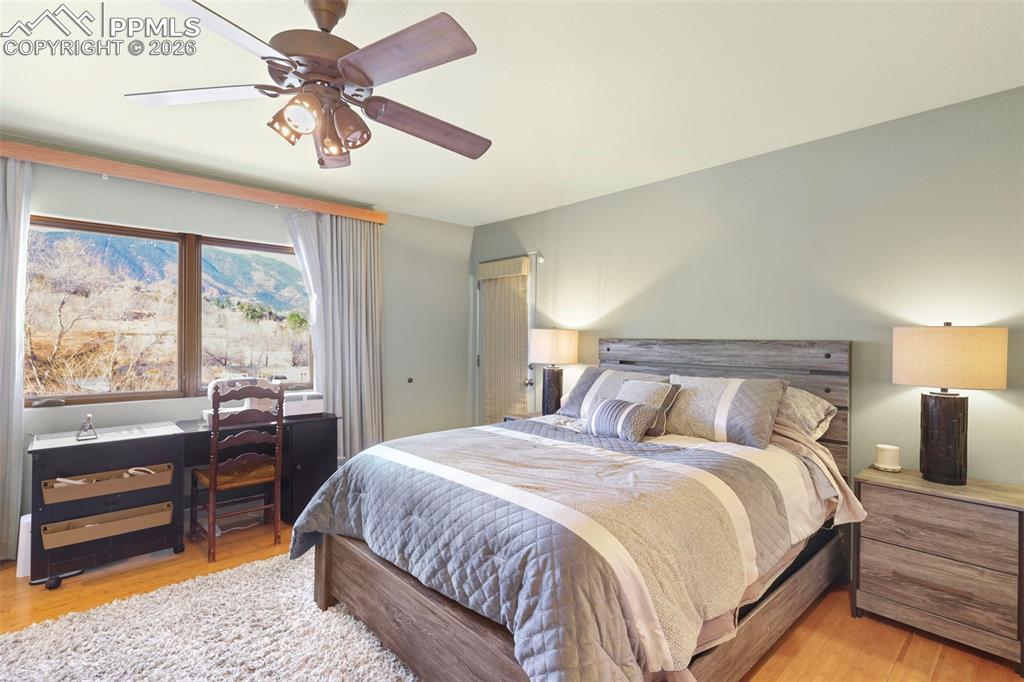 Bedroom with light wood-type flooring and ceiling fan