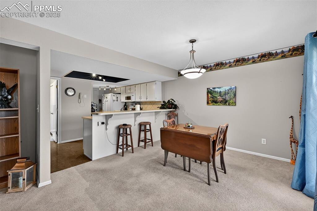 Dining area with breakfast bar.